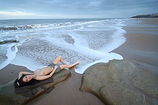 Model Charley lying on the beach