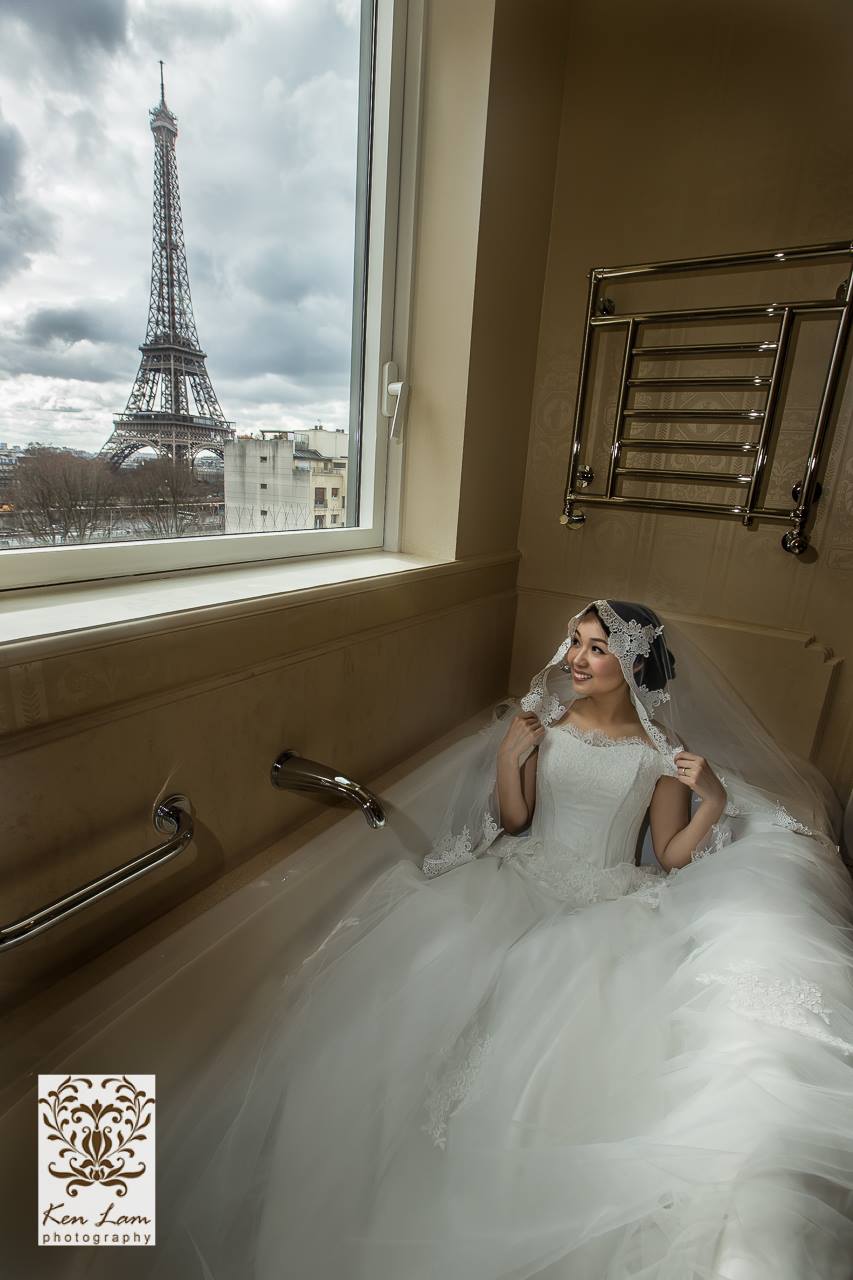 Beautiful Bride looking out at the Eiffel Tower, view from Shangri-La Paris