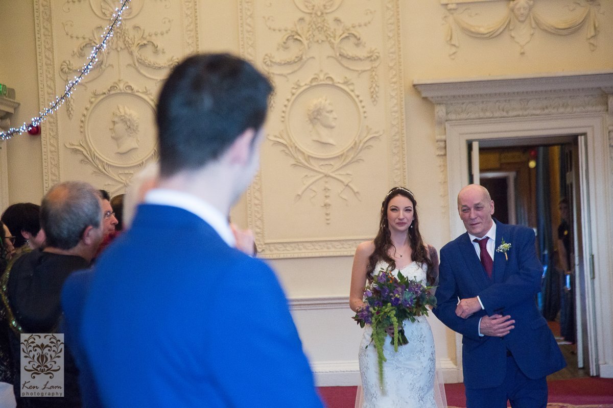 Cat's father walking Cat down the aisle at Lumley Castle.